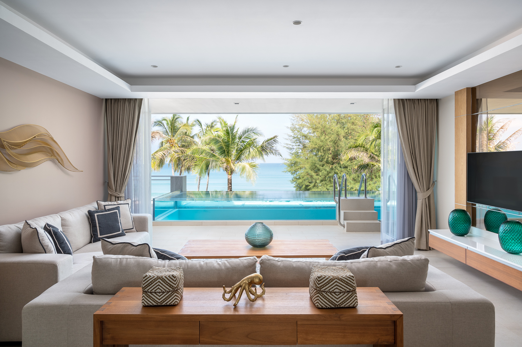 รูปของ การออกแบบตกแต่งภายใน สำหรับ อพาร์ทเมนท์หรูริมชายหาด ใน Angsana Beach Front 4
